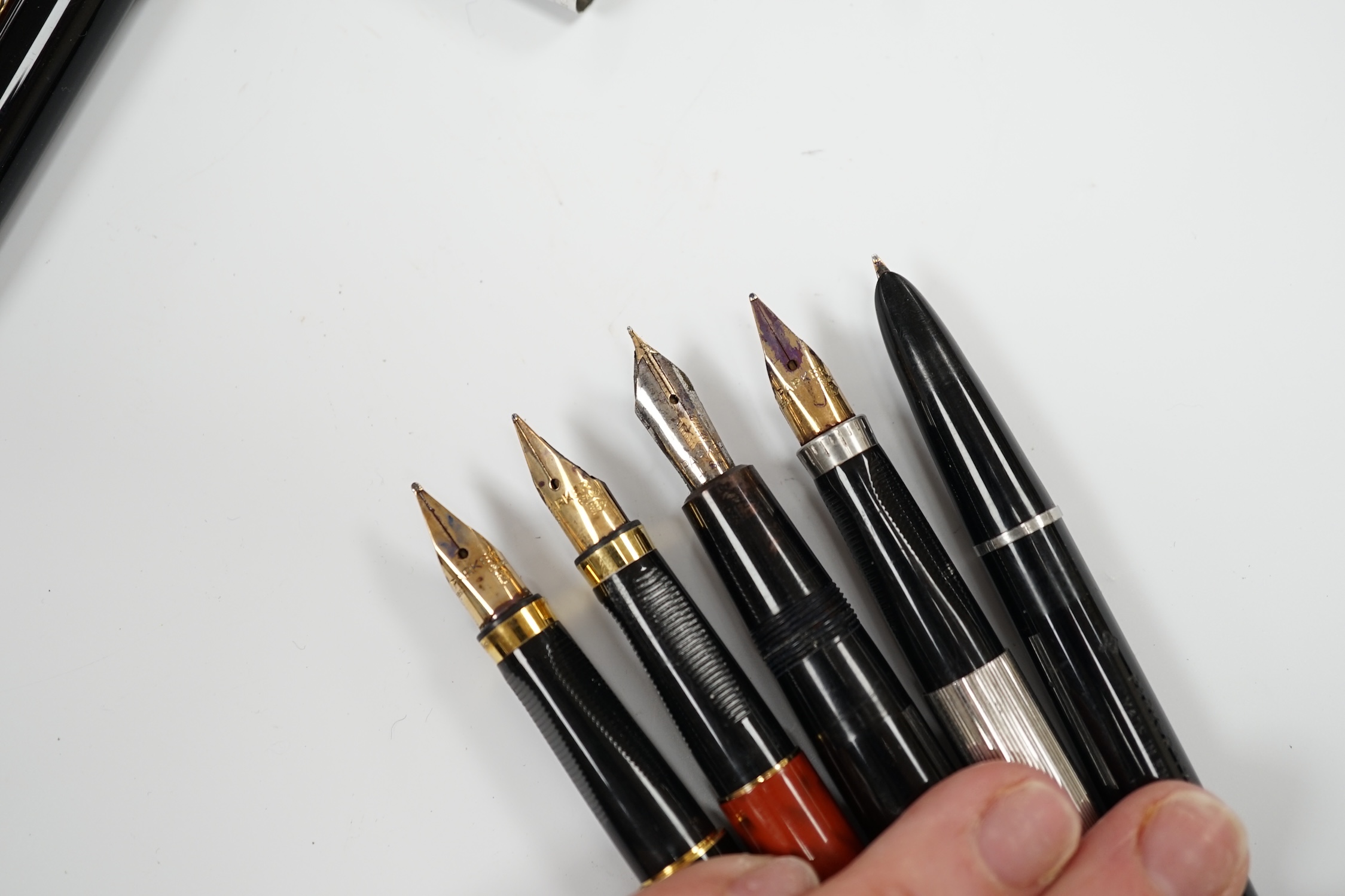 A Parker white metal fountain pen and four other Parker fountain pens, the vendor being an ex-Parker Pen employee